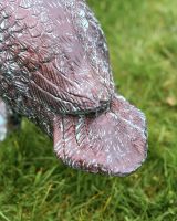 Verdigris Swan Facing Down close up of tail