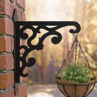 Victorian Gingerbread Style Hanging Basket Bracket Mounted onto a Brick Wall 