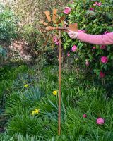 Vintage Farmhouse Garden Wind Spinner with Hand in Shot for Scale