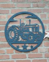 Vintage Fender Tractor Silhouette Garden Wall Art to scale with hand in shot