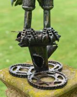 Close up of intricate feet and base detail on recycled metal art sculpture