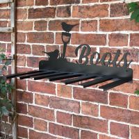 Wall Mounted Robin Iron Boot Holder Mounted on a Brick Wall