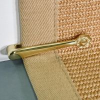 Close-up of the Polished a Brass Stair Clip in Place