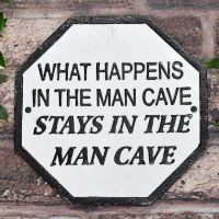 "What Happens In The Man Cave Stays In The Man Cave" Cast Iron Sign on a Brick wall Outside