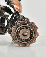 close up of wheel on industrial scrap metal art