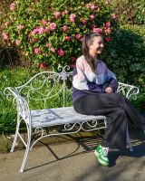 "Ophelia" Wrought iron Two Seater Garden Bench with Lady Sat on Bench for Scale