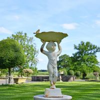 Cream Cherub Bird Bath in situ in the Garden Cream Cherub Bird Bath in situ in the Garden