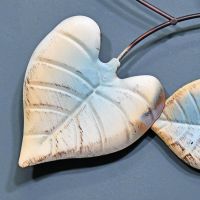 Close-up of the Rustic Cream and Blue Finish on the Leaf