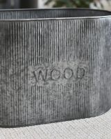 Close Up Of The Natural Steel Finish On The Ribbed Log Basket 