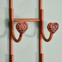 Close up of detailed heart bottle hooks Close up of detailed heart bottle hooks