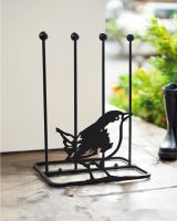 Boot rack with Wren silhouette in porch