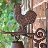 Close up of rooster and bracket arm 