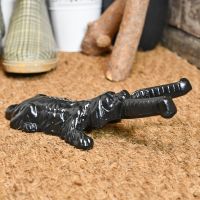 Black Cast iron boot jack on door matt