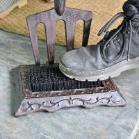 Close up of cast iron base and brush Close up of cast iron base and brush