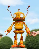 Scale image of yellow robot sculpture