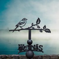 Yellow wagtail weathervane on a lovely foggy day