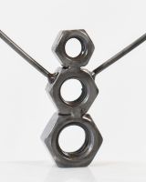 Close up of snowman body detail on recycled metal art sculpture