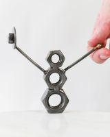 Scale image of snowman scrap metal art sculpture