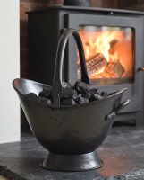 The 43cm "Waterloo" Black Iron Coal Bucket Placed on a Stone Tile Floor in Front of a Log Burner Stove - Digital Illustration The 43cm "Waterloo" Black Iron Coal Bucket Placed on a Stone Tile Floor in Front of a Log Burner Stove - Digital Illustration