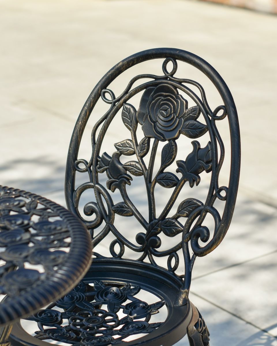 Close up of ornate detail on chair backrest on garden furniture set