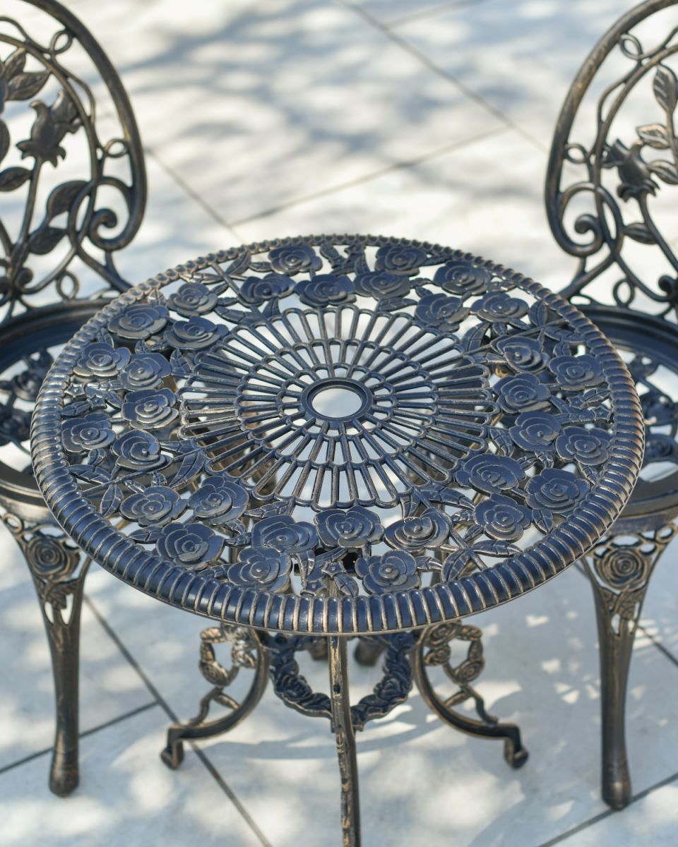 Close up of parasol hole on table top on outdoor bistro set