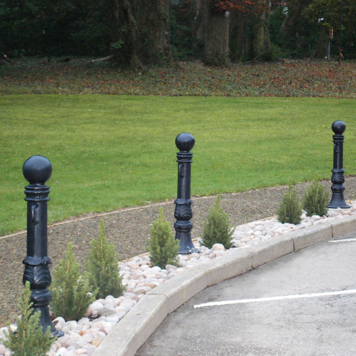 Black Avondale bollard in parking area