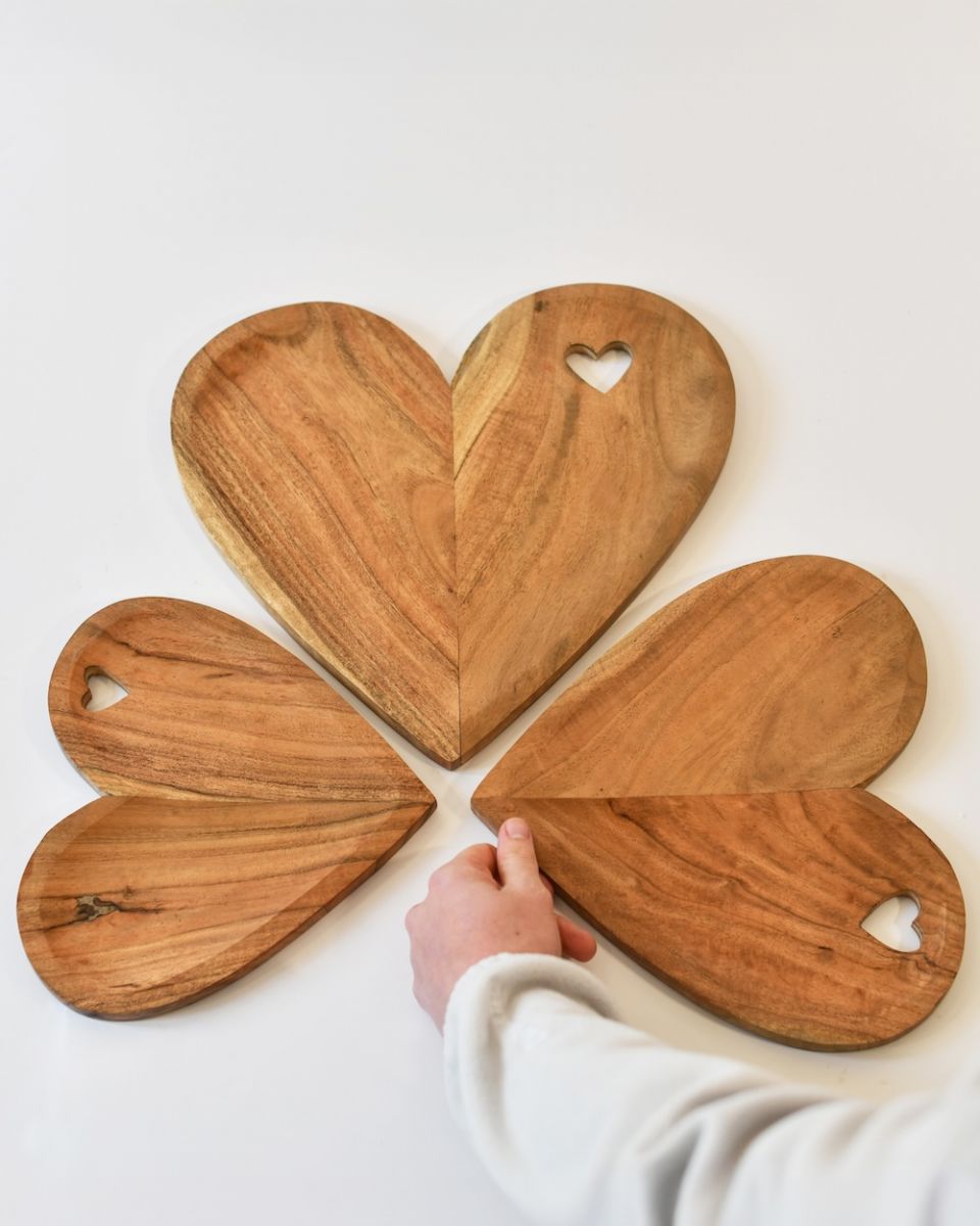 Scale of natural wood heart shaped serving platters
