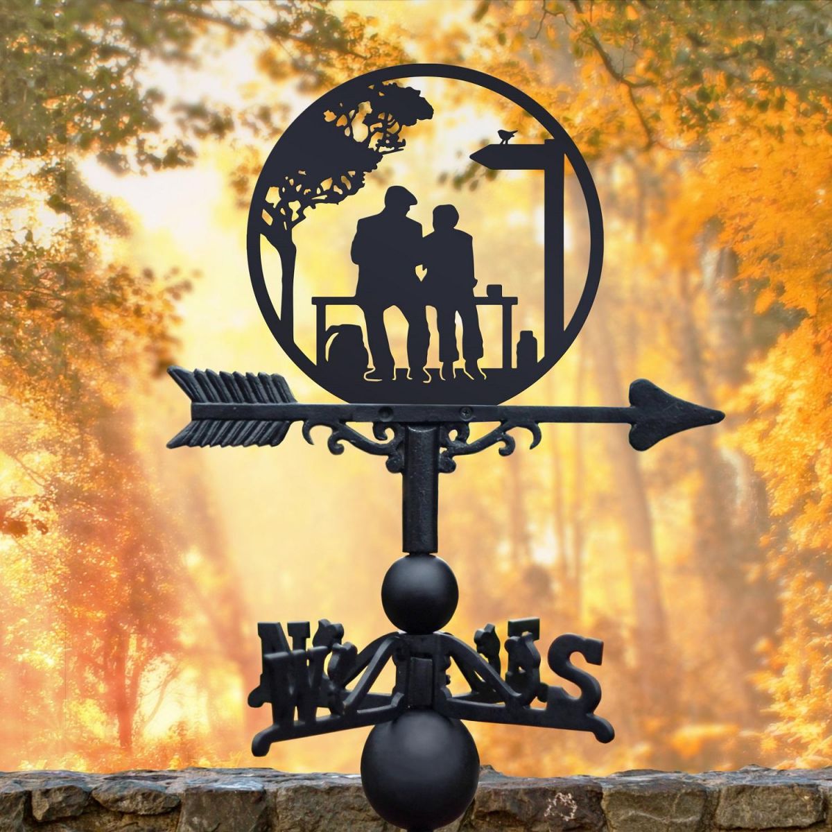 Weathervane featuring lovers on a bench 