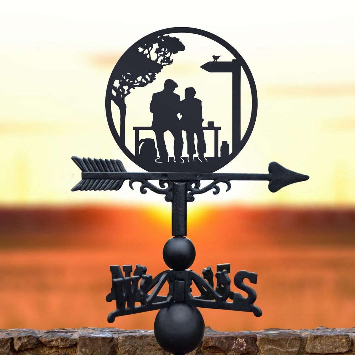 Weathervane featuring lovers on a bench 