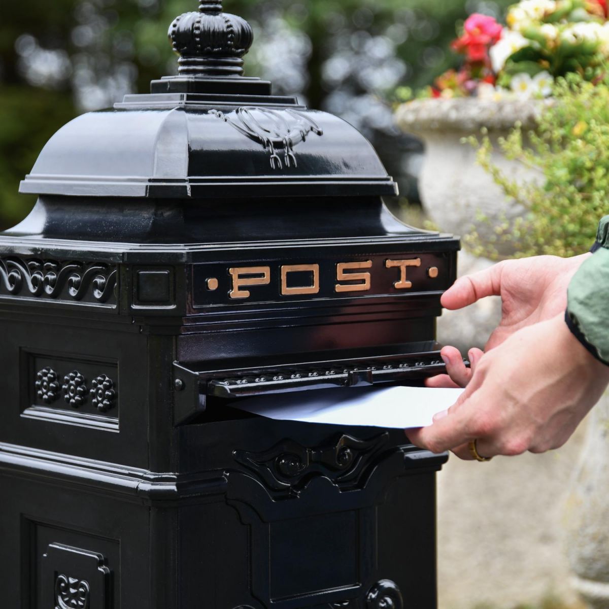 Letter Opening in Use on “Blackberry Harvest” Black Camden Deluxe Free Standing Post Box