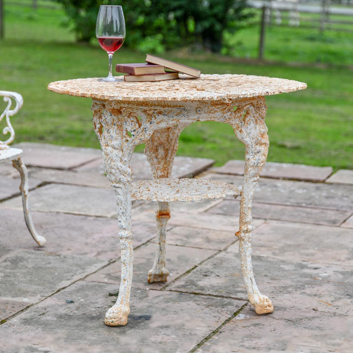 "Merriweather" Round Cast Aged Rustic Cream Iron Victorian Table in Use in the Garden
