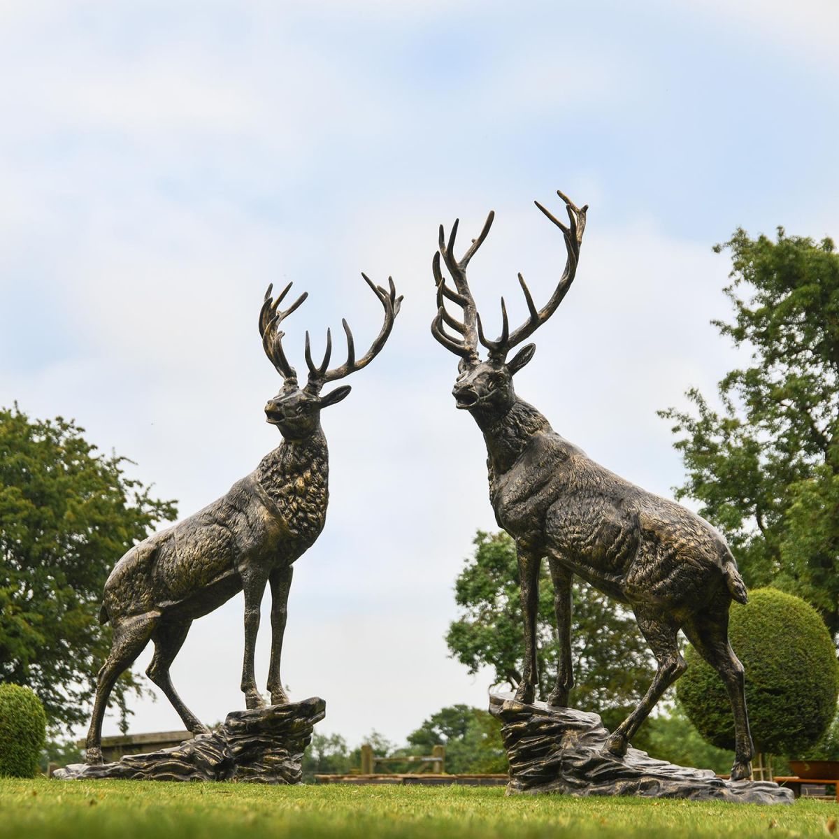 Pair of “Renwick” Stag on Rock Sculptures in Situ