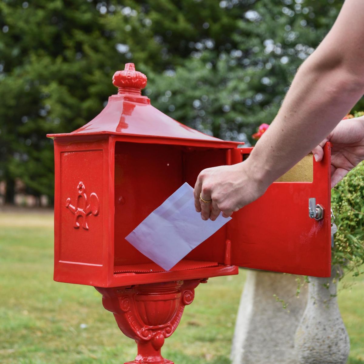 Parcel Box Opening in Use on “Saffron Blossom” Red Suffolk Post Box with Stand