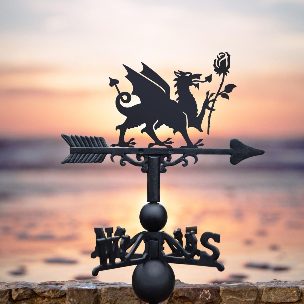 Welsh Dragon & English Rose weathervane by the sea