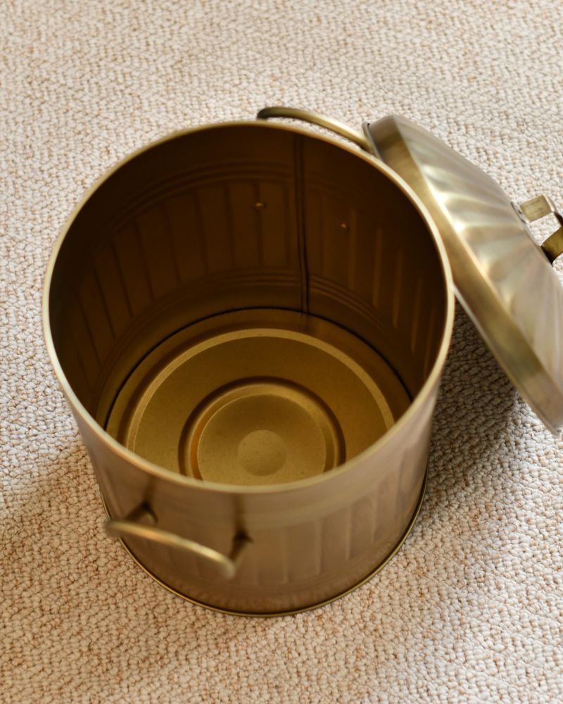 Above The Traditional Gold Log Bucket With A Lid