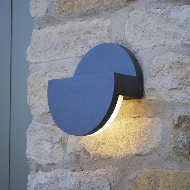 Adjustable Circle Wall Light in Use on a Stone Wall