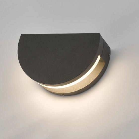 Adjustable Circle Wall Light in Use on a Grey Wall