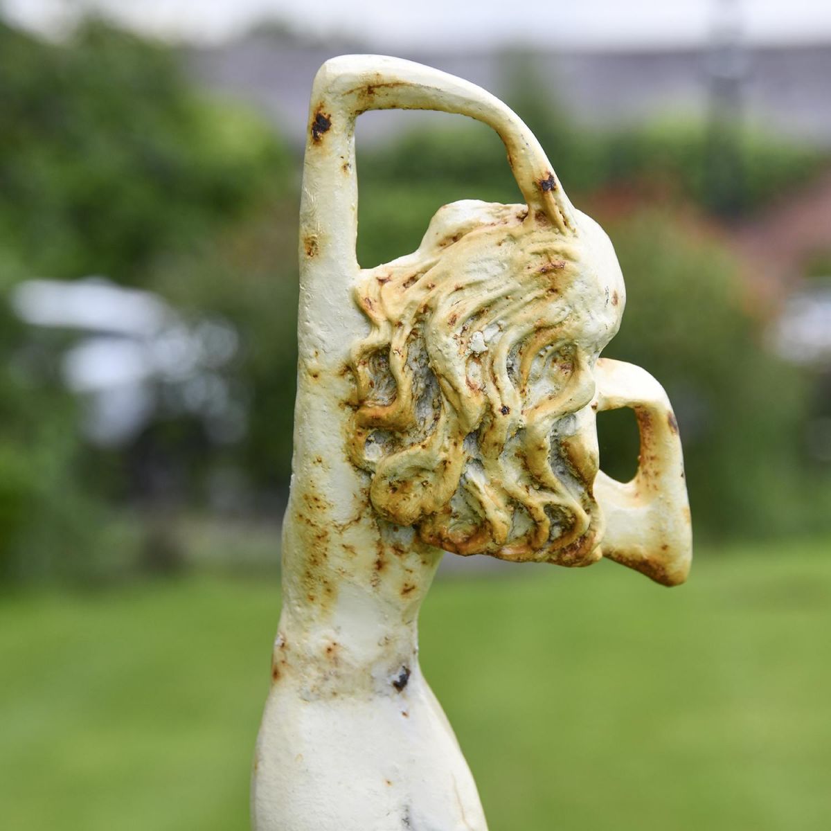 Close-up of the Detail on the Lady Standing on Clam Sculpture
