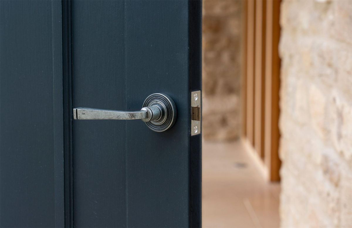 Aged Pewter Unsprung Lever Door Handle on Beehive Rose on Door