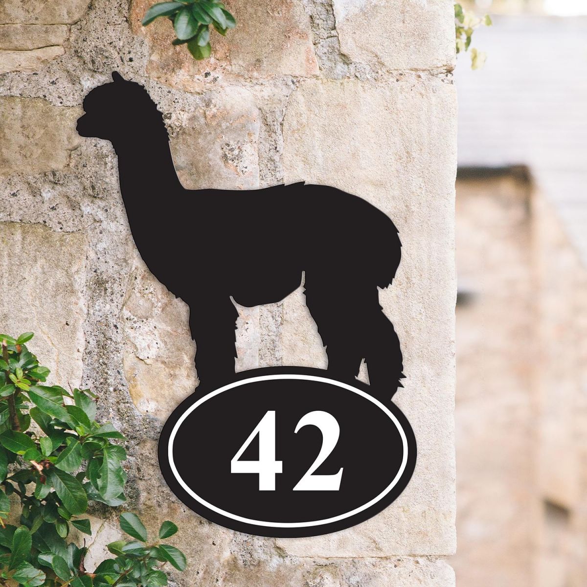 Alpaca Iron House Number Sign on a Garden Wall