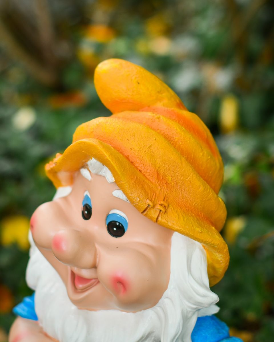 Angled close up of colourful garden gnome ornament