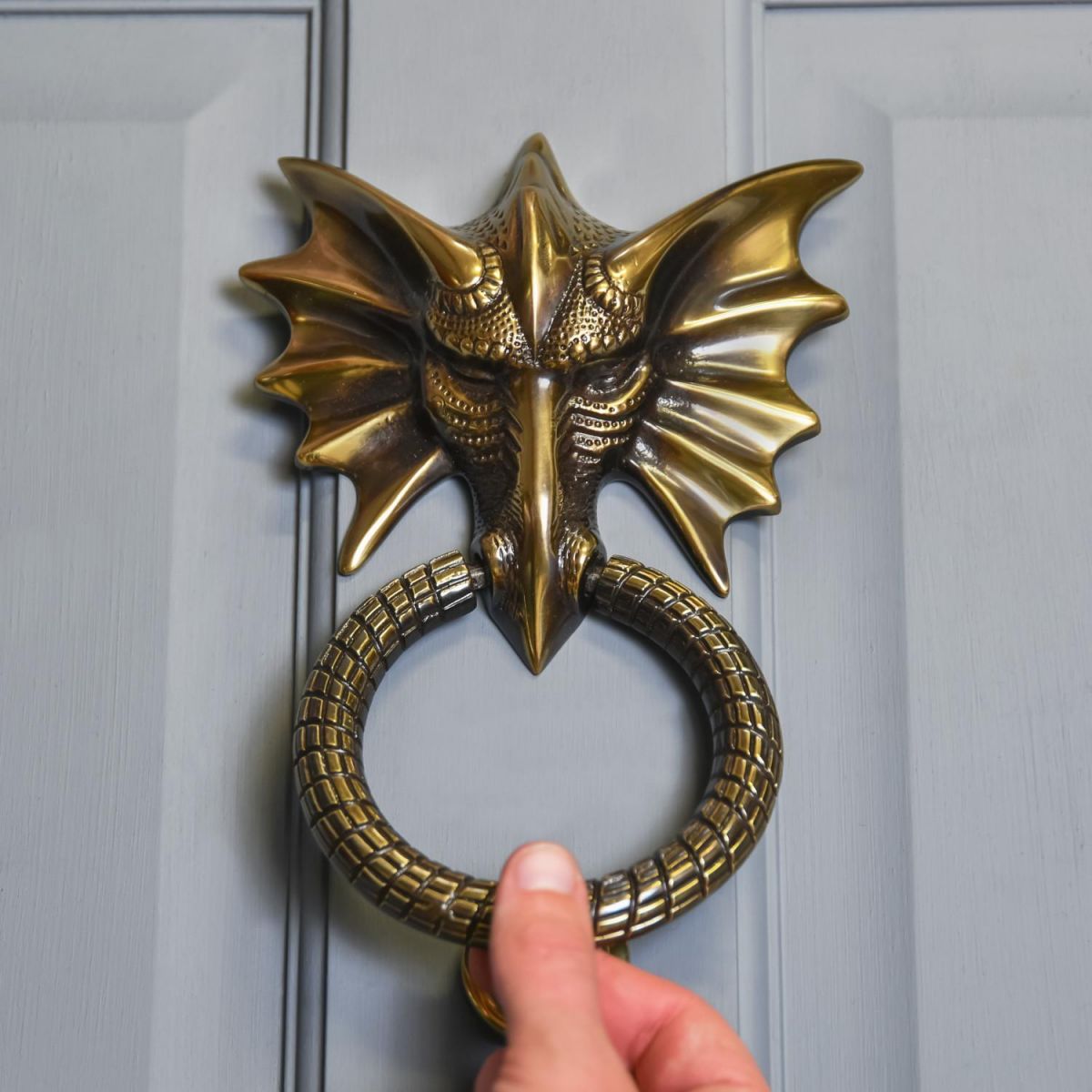 Scale Shot of Antique Copper Dragon Head Door Knocker