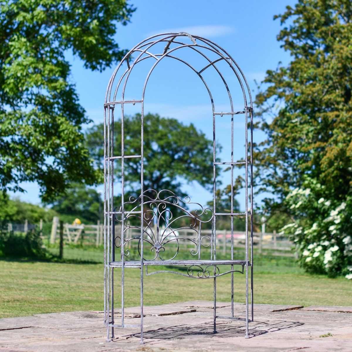 Antique Grey Arbour With Oval Seat in Situ in the Garden