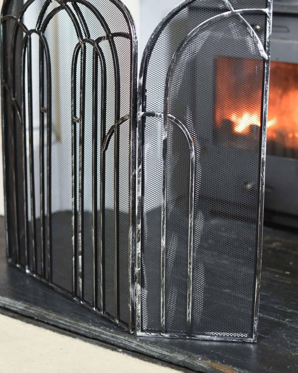 Close-Up of Antique Silver Arched Three Fold Fire Guard in SItu