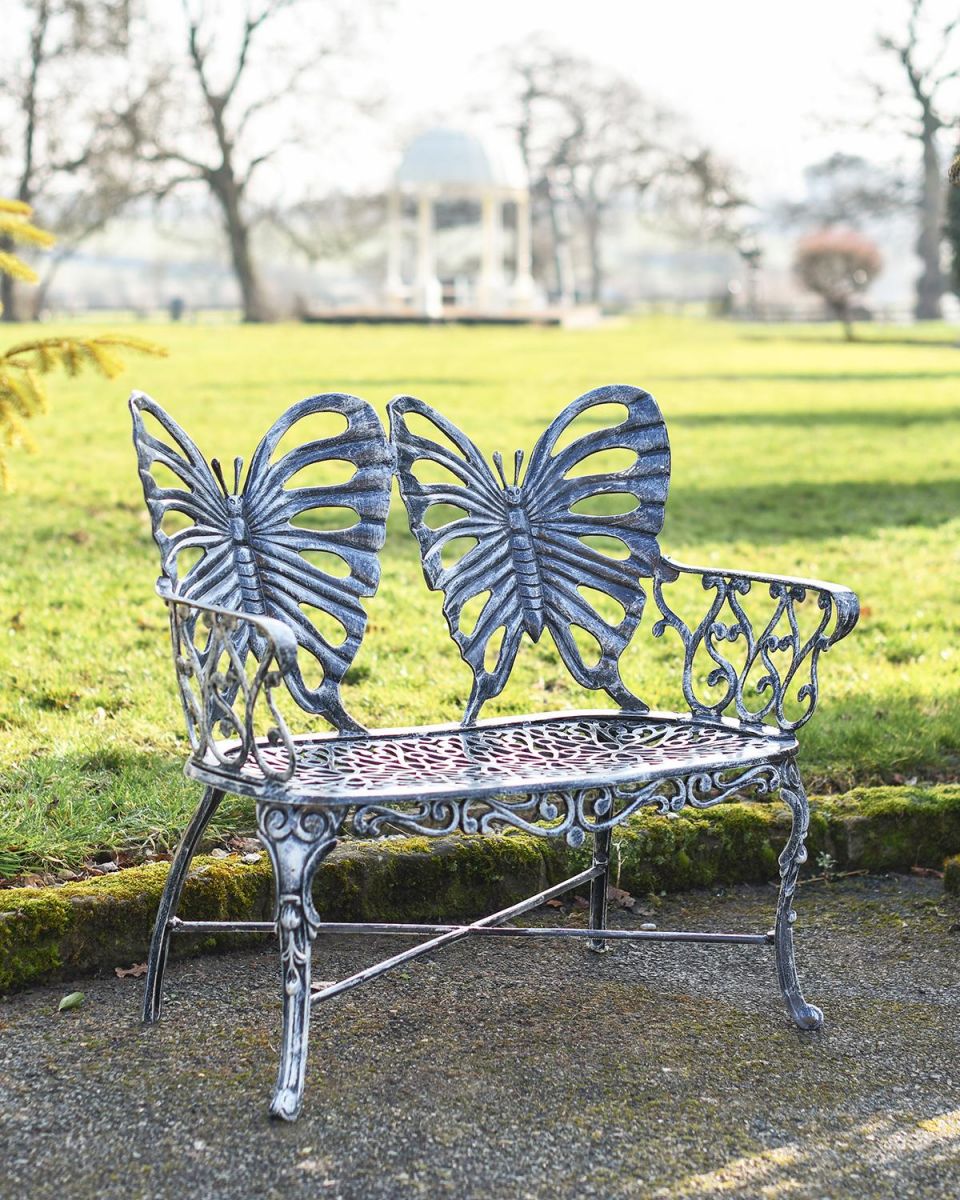 Antique Silver Butterfly Design Two Seater Bench in Situ in the Garden