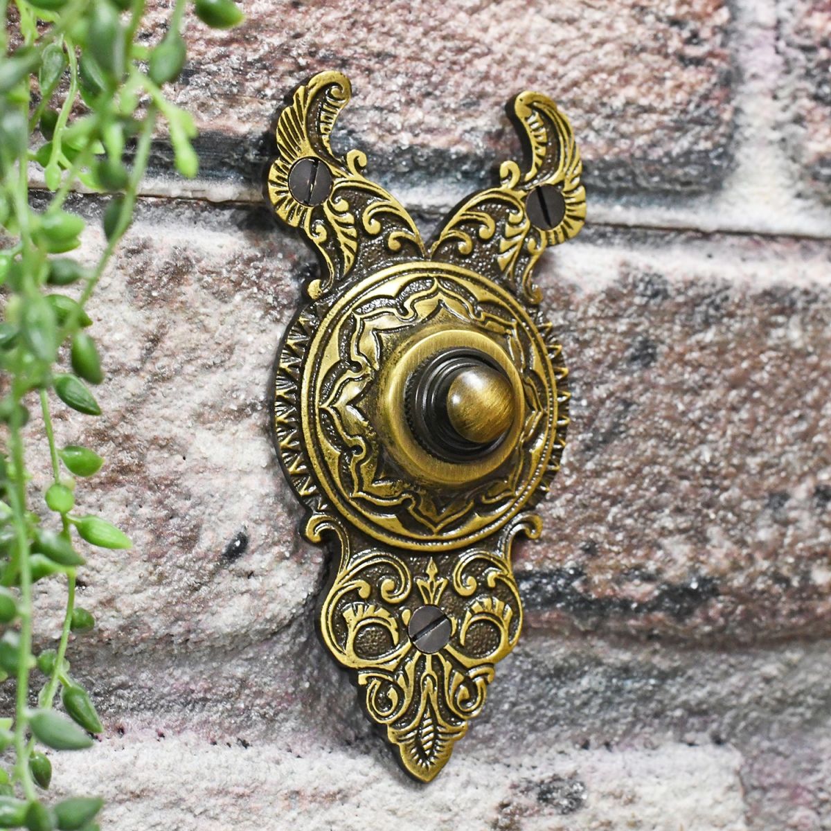 Antique Brass Finish Door Bell on Brick Wall
