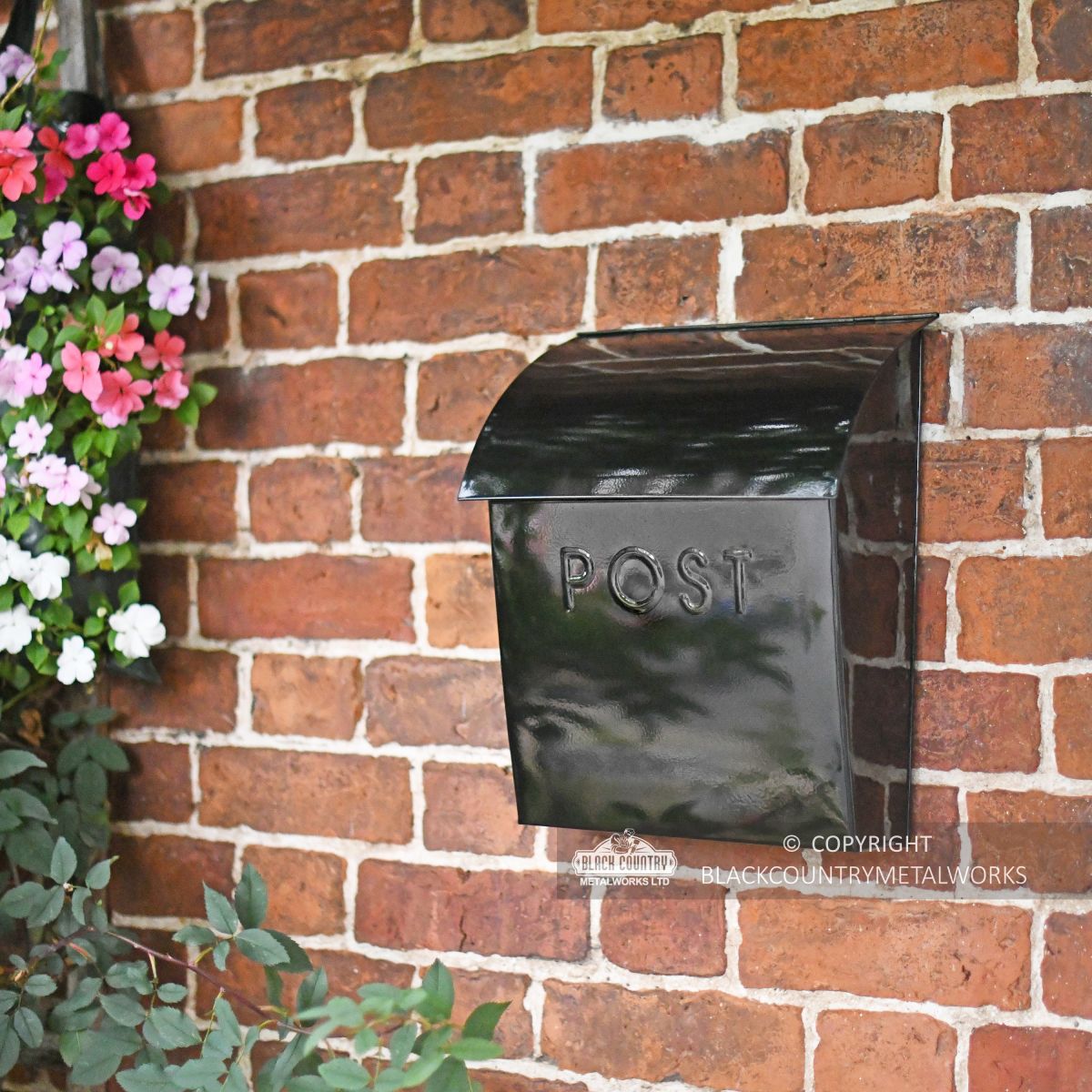Stylish post box with curved lid