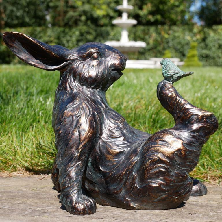 Bird Sitting on Rabbit Garden Sculpture in Situ