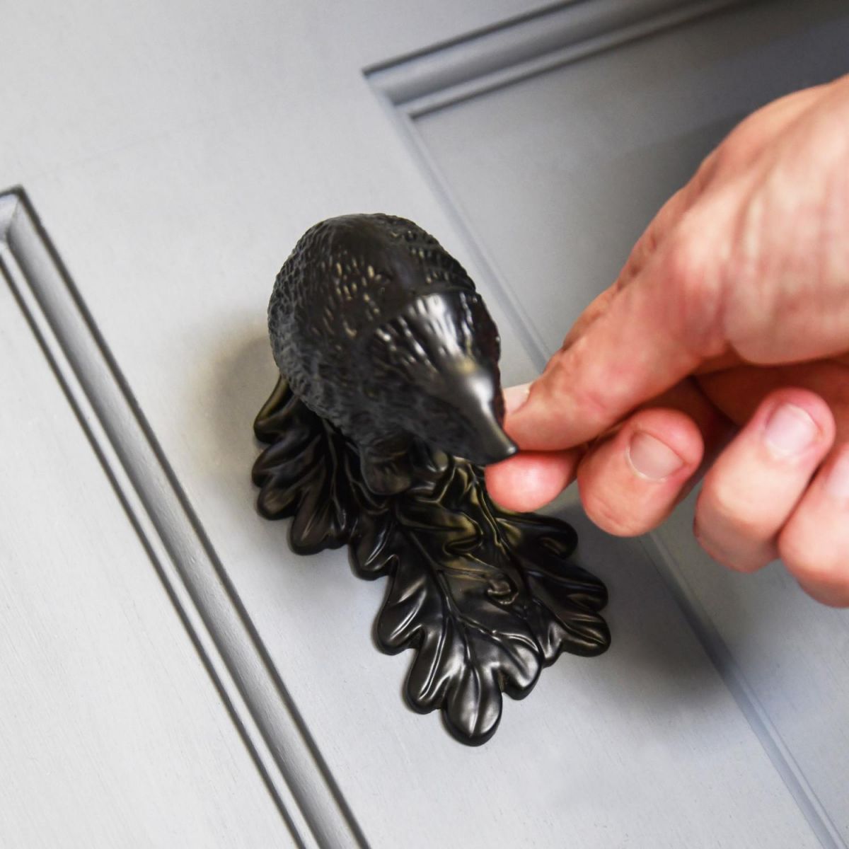 Scale Shot of Black Cast Iron Hedgehog Door Knocker