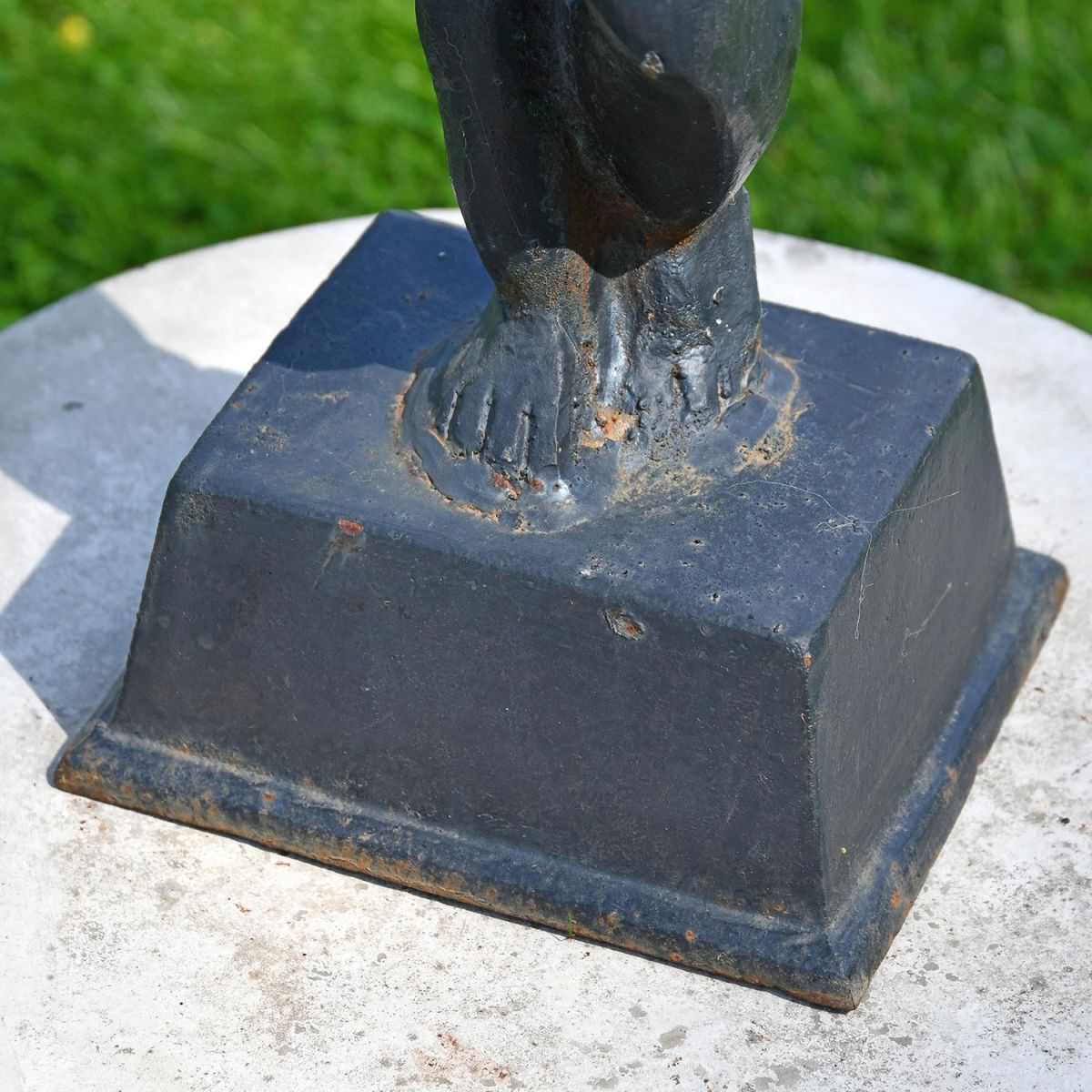 Close-up of the Base on the Black Cherub Bird Bath